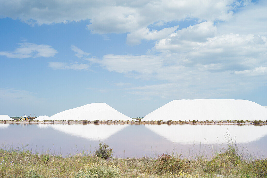 Salt mountains in the salt marshes, Aigues-Mortes, Camargue, Gard, Languedoc-Roussillon, France