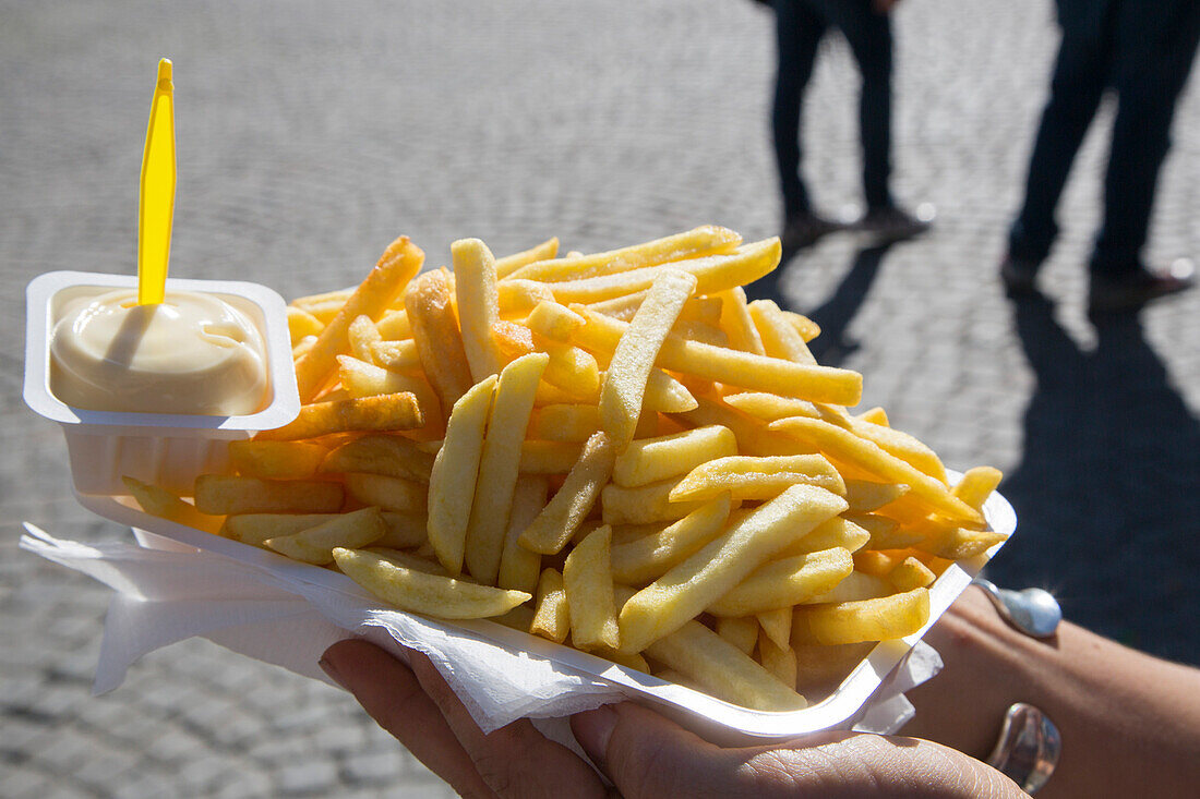 Delicious chips, pommes frites with mayonnaise from Friteri 1999 snack shop on Grote market square in the old town, Bruges (Brugge), Flemish Region, Belgium