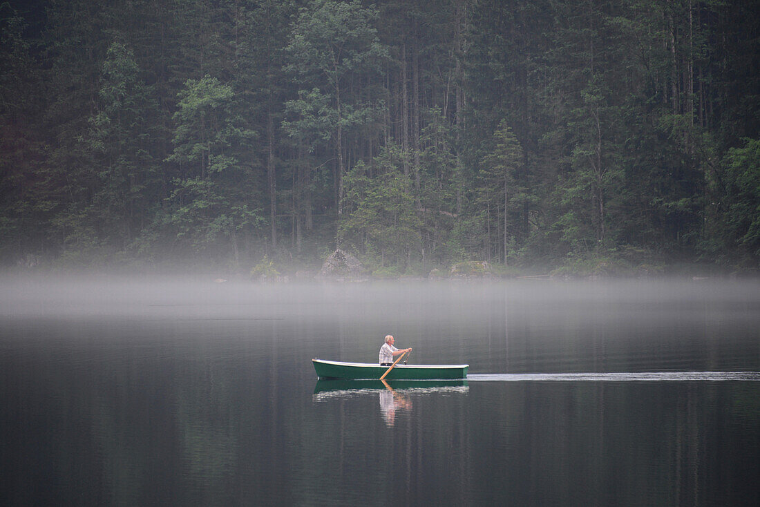 Rowing boat on Lake Hintersee near Ramsau, Berchtesgaden, Upper Bavaria, Bavaria, Germany