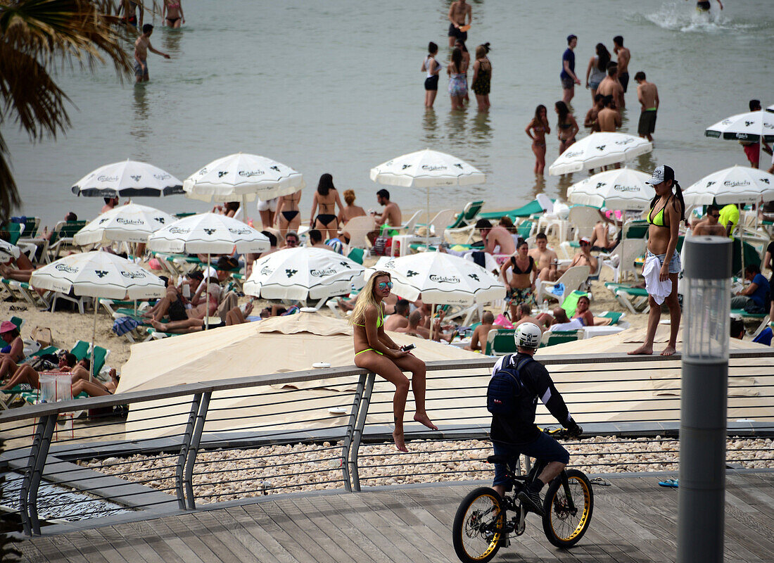 People sunbathing at Gordon beach, Tel Aviv, Israel