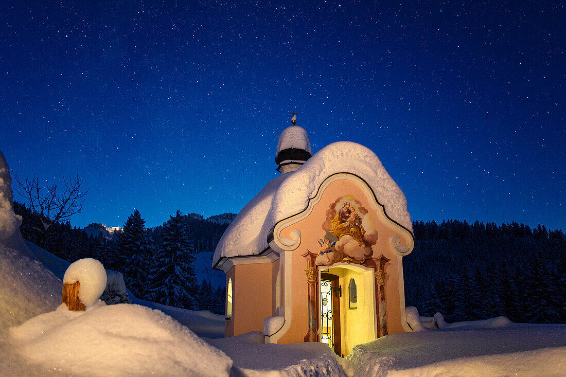 Chapel in winter with starry sky, Upper Bavaria, Germany, Europe