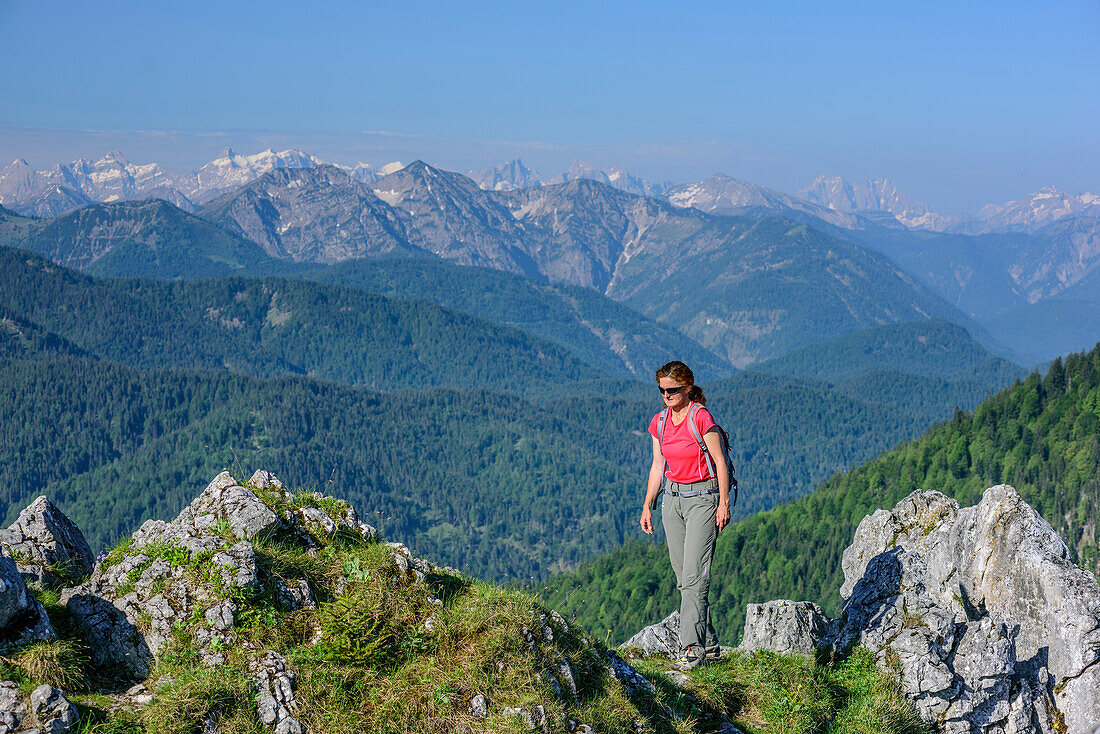 Woman ascending towards Leonhardstein, view to Karwendel range, Leonhardstein, Bavarian Alps, Upper Bavaria, Bavaria, Germany