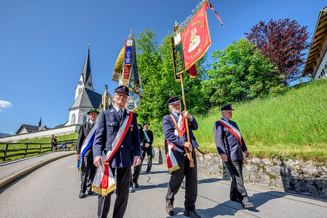 Procession during religious festival of Feast of Corpus Christi, church of Kreuth in background, Kreuth, Bavarian Alps, Upper Bavaria, Bavaria, Germany