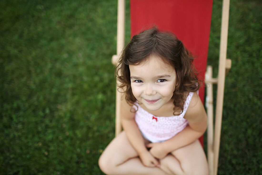 of a 4 years old girl on a lounge chair for child