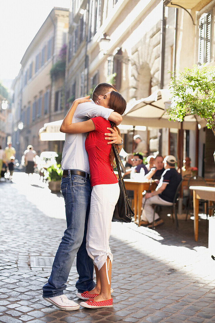 Couple hugging outdoors