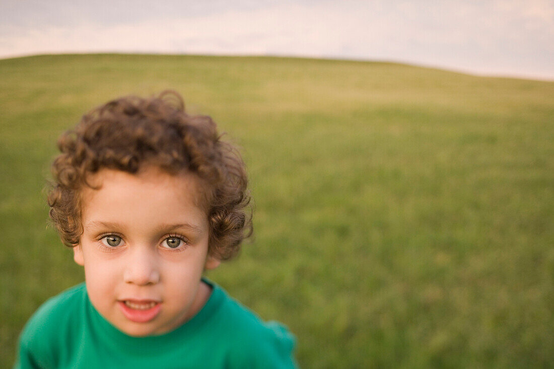 Mixed race boy in field