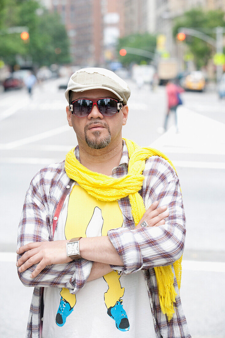Hispanic man in unique clothing on urban street