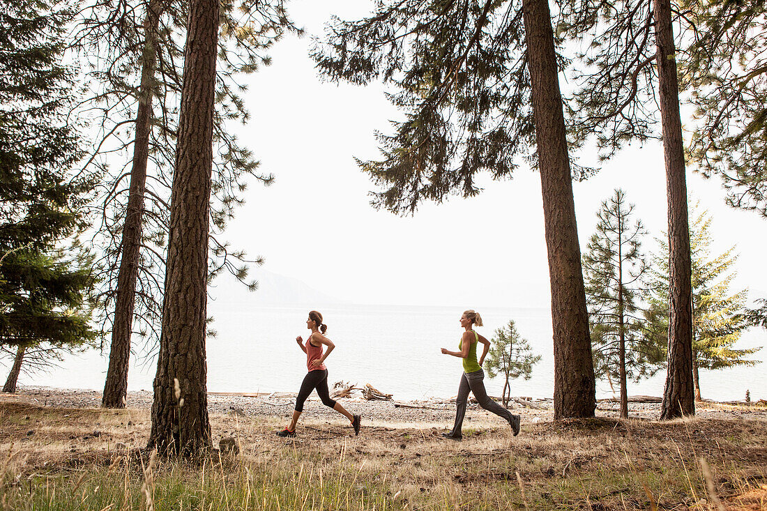 Caucasian women running in forest