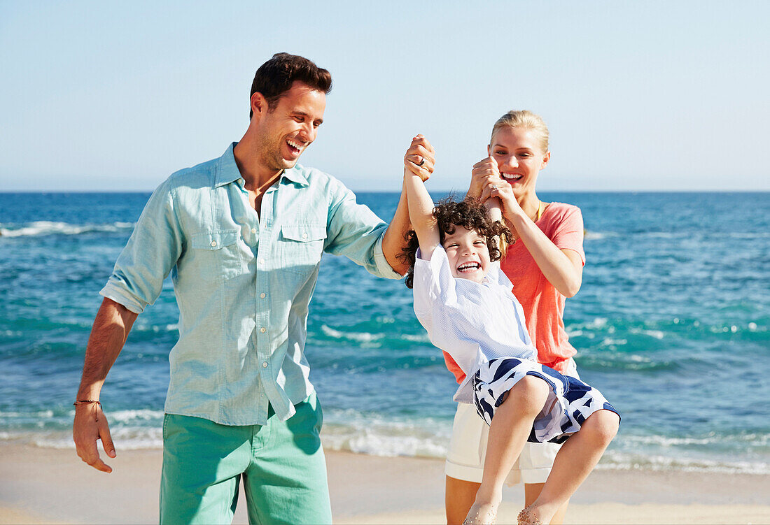 Family playing together on beach