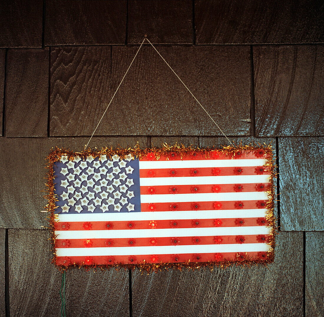 Handmade American flag hanging on wall