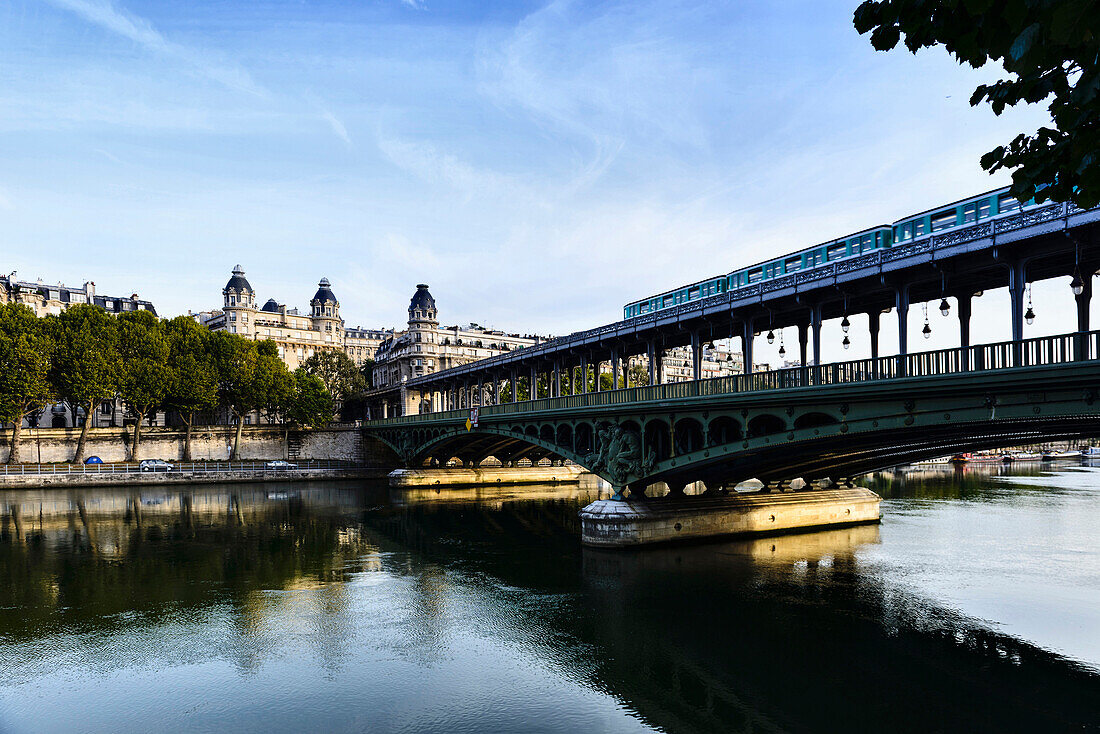 Paris city skyline reflected in river, Paris, France