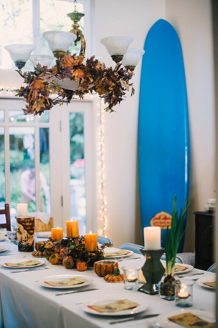 Dining Room with Autumn Centerpiece and Surfboard