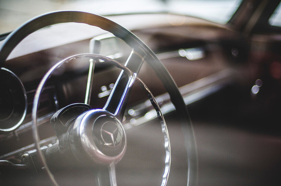 Steering Wheel of Vintage Mercedes Through Window
