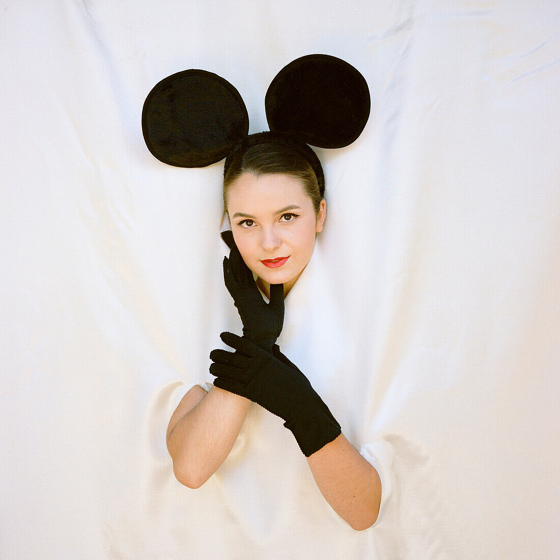Teenage Girl Wearing Mouse Ears and Long Black Gloves