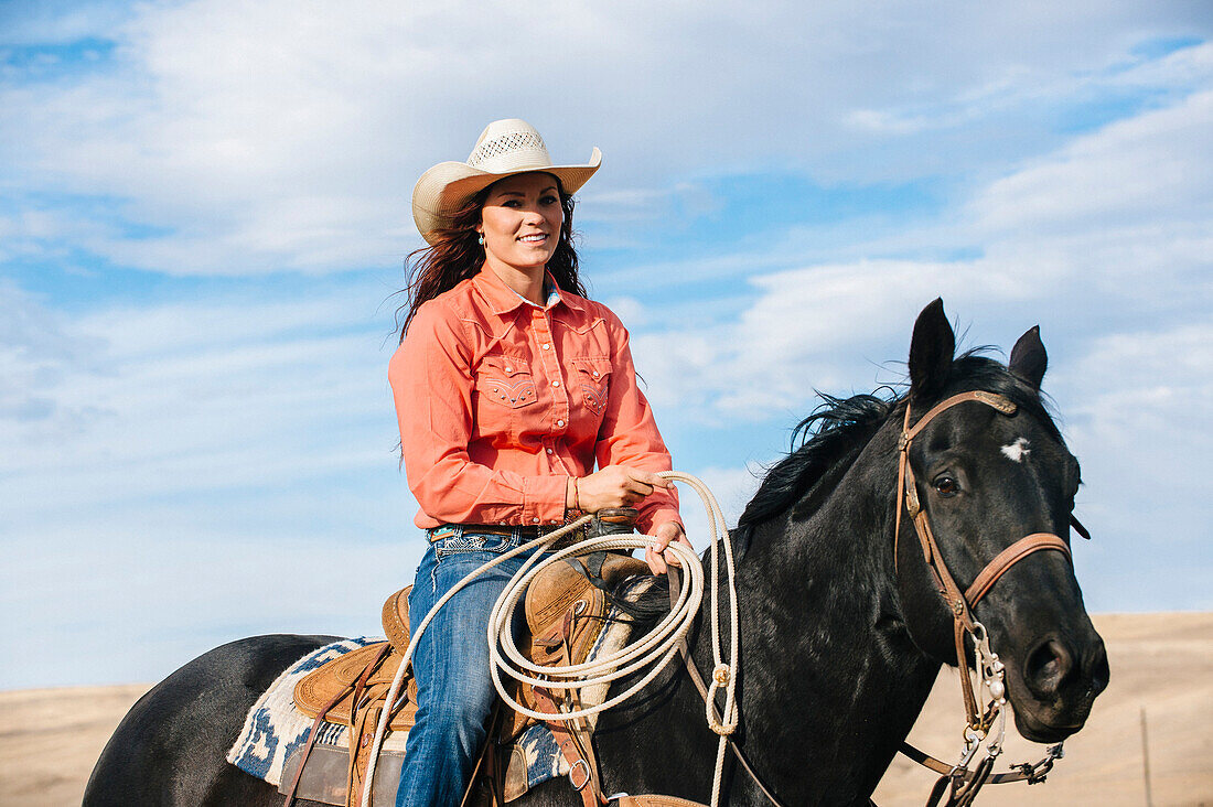 Caucasian woman smiling on horse, Jospeh, Oregon, USA