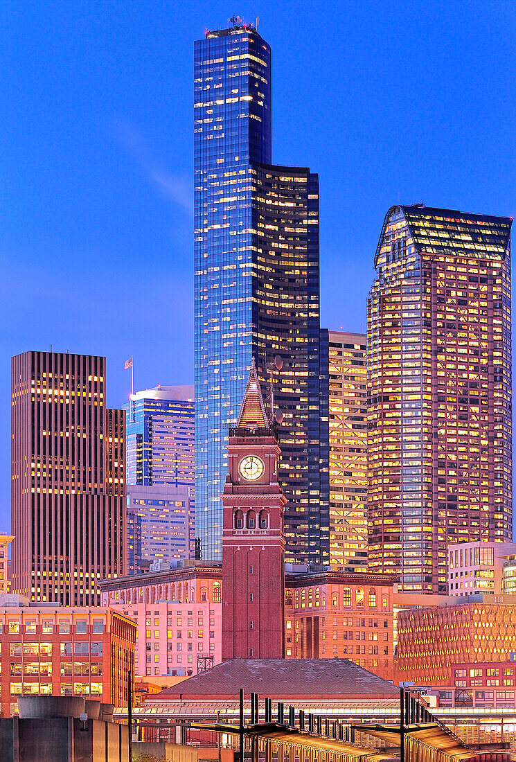 Clock tower and illuminated high rise buildings in Seattle city skyline, Washington, United States, Seattle, Washington, USA