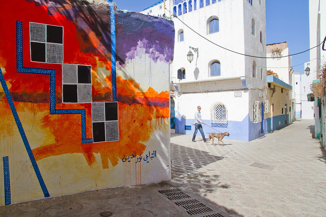 Morocco, Asilah, street in old medina, mural in foreground