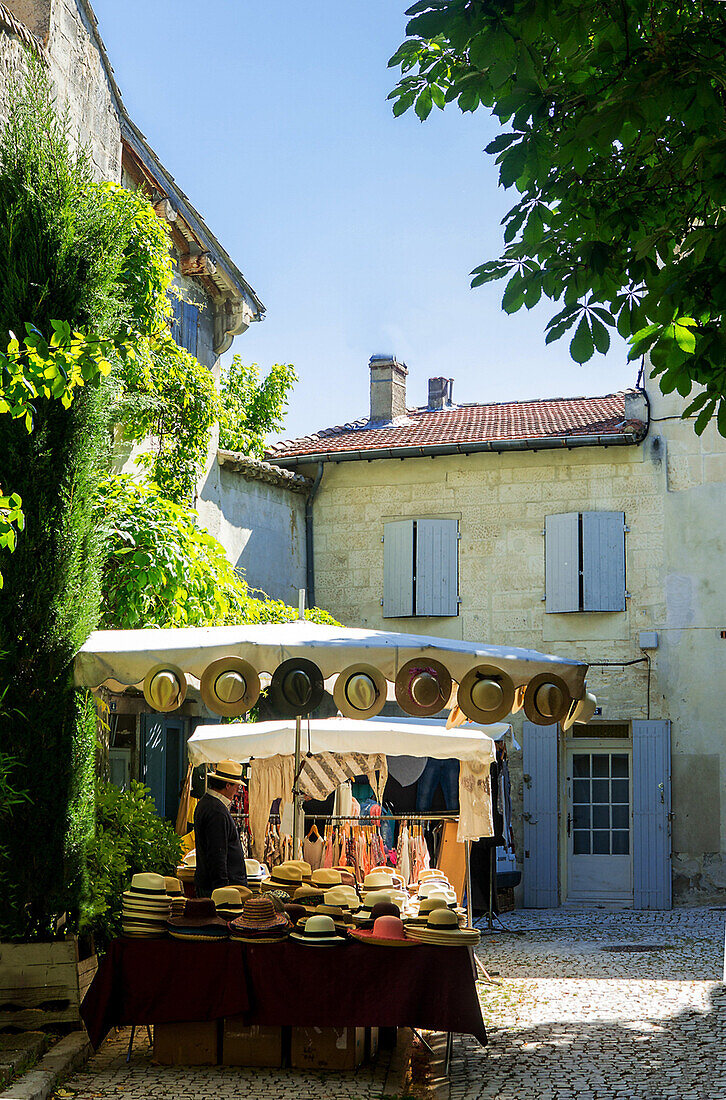 France, South Eastern France, Bouches du Rhône, St Rémy de Provence, market, hat seller