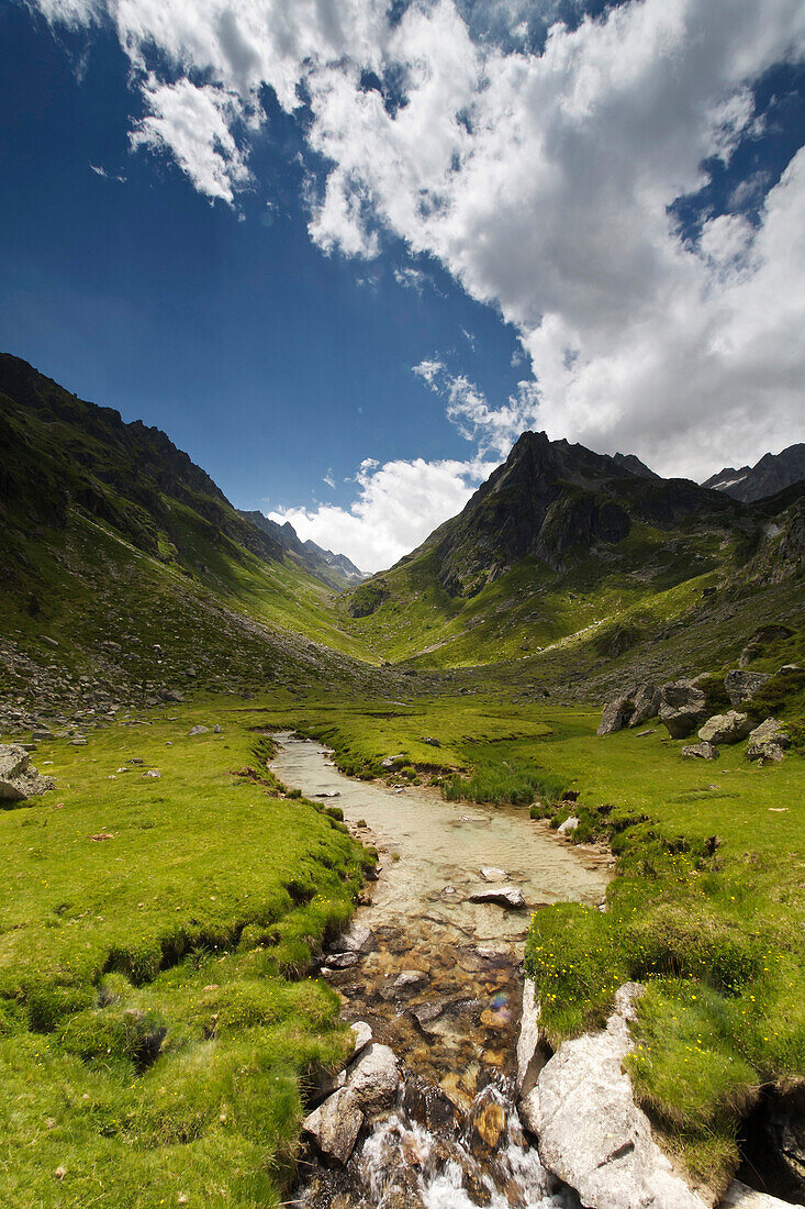 France, Hautes-Pyrenees, Play of shadows and light with clouds over the Arrens river