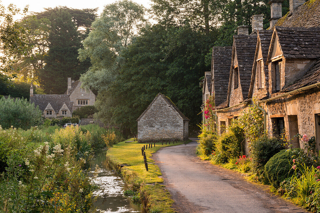 Picturesque cottages at Arlington Row in the Cotswolds village of Bibury, Gloucestershire, England, United Kingdom, Europe