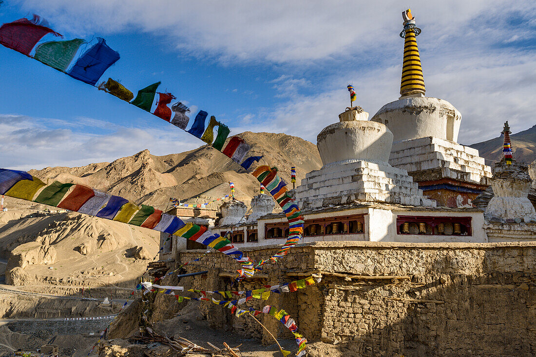 Prayer flags and stupa at the monastery at Lamayuru, Ladakh, Himalayas, India, Asia