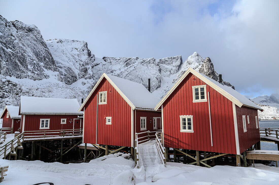 Fresh snow covering the typical Norwegian homes, the Rorbu, in the Lofoten Islands, Arctic, Norway, Scandinavia, Europe