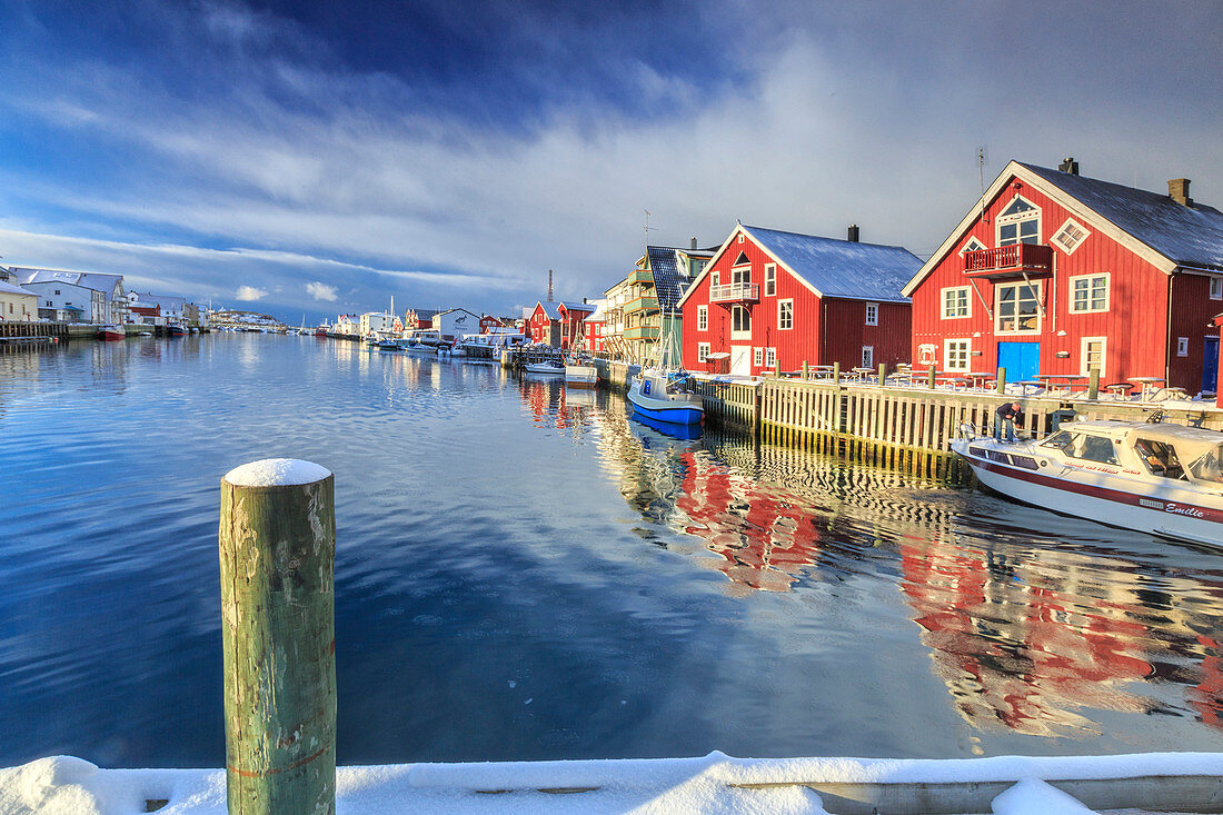 View of colorful fishermen's houses and private boats overlooking the canal-port of Henningsvaer, Lofoten Islands, Arctic, Norway, Scandinavia, Europe