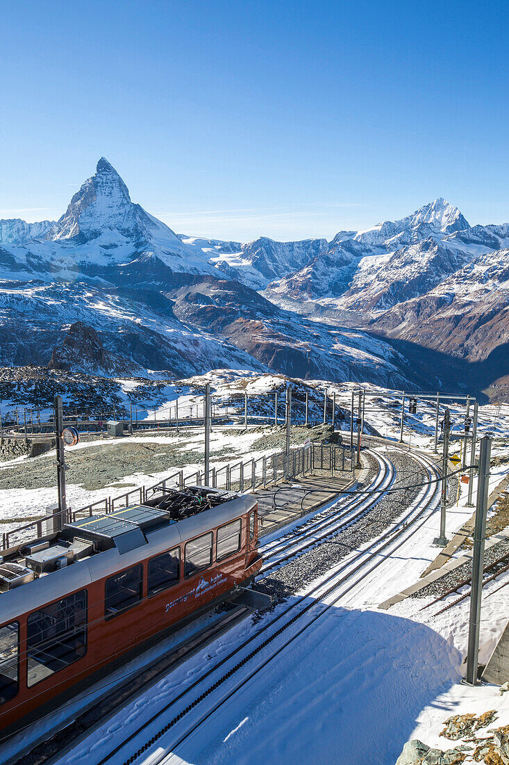 A train from Zermatt approaching the Gornergrat Station facing the majestic shape of the Matterhorn, Valais, Switzerland, Europe