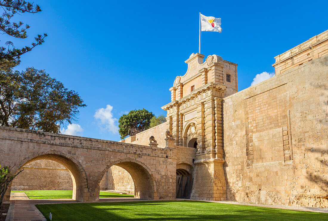 The Main gate with moat, garden and ramparts, Mdina, a Medieval walled city, Mdina, Malta, Europe