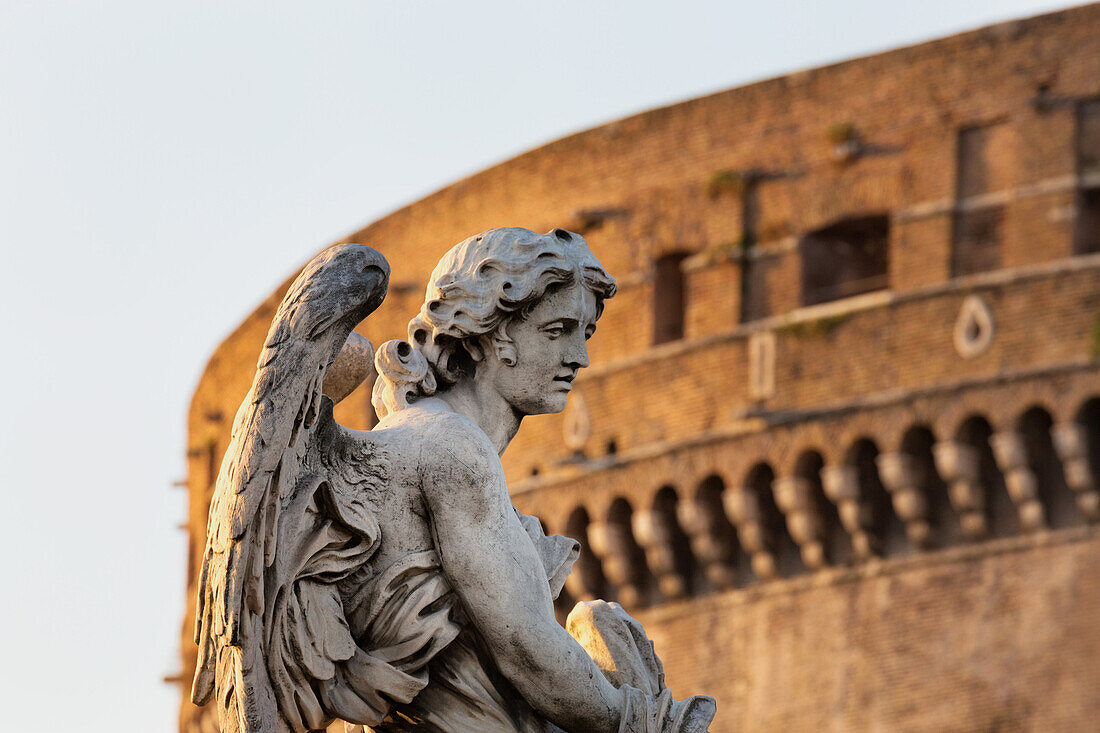 Angel statue on Ponte Sant' Angelo with Castel Sant' Angelo, Rome, Lazio, Italy, Europe