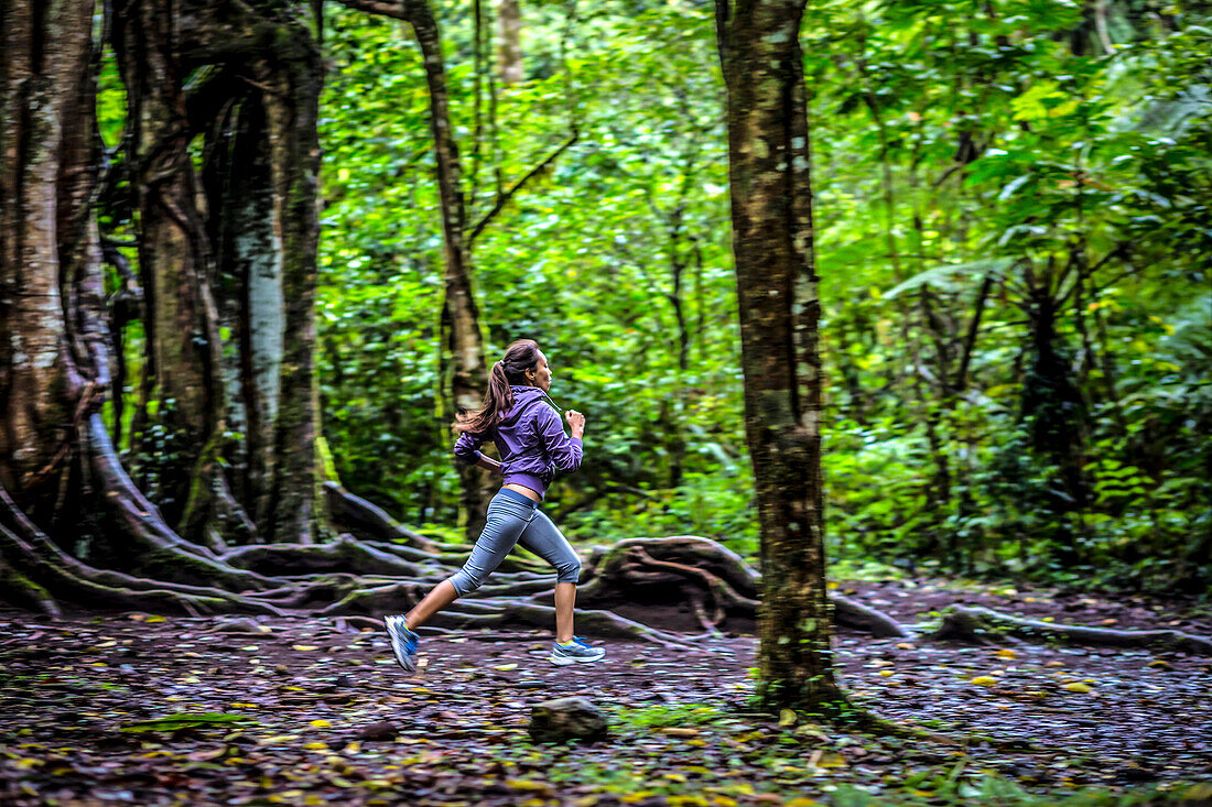 Woman running at forest.