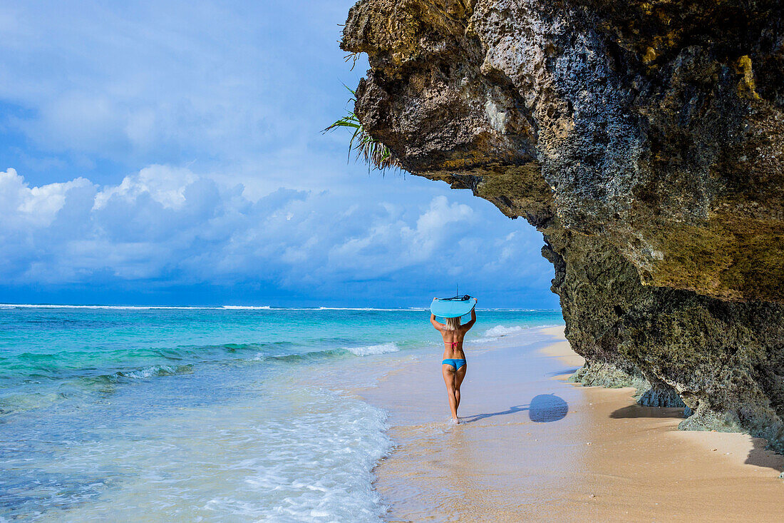 Sufer girl on the beach.