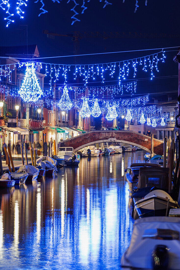 Christmas decorations reflected in a canal, Murano, Venice, UNESCO World Heritage Site, Veneto, Italy, Europe