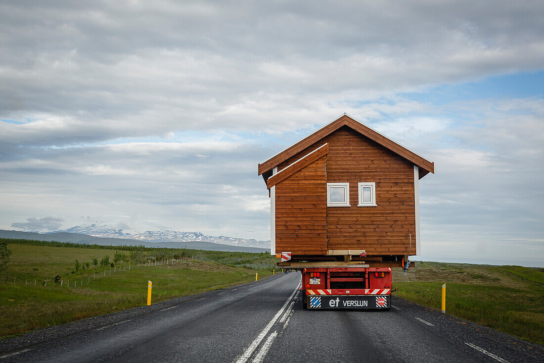 Wooden house being transported on a truck, South Iceland, Iceland, Polar Regions
