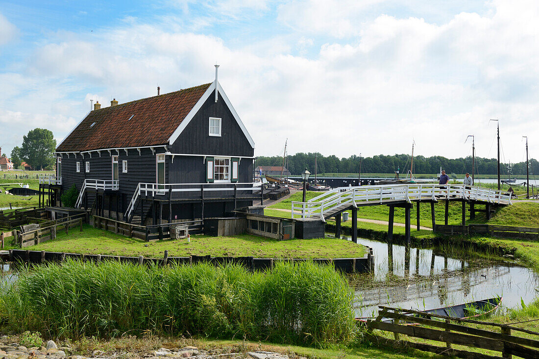 Canal and traditional building, Zuiderzee Open Air Museum, Lake Ijssel, Enkhuizen, North Holland, Netherlands, Europe