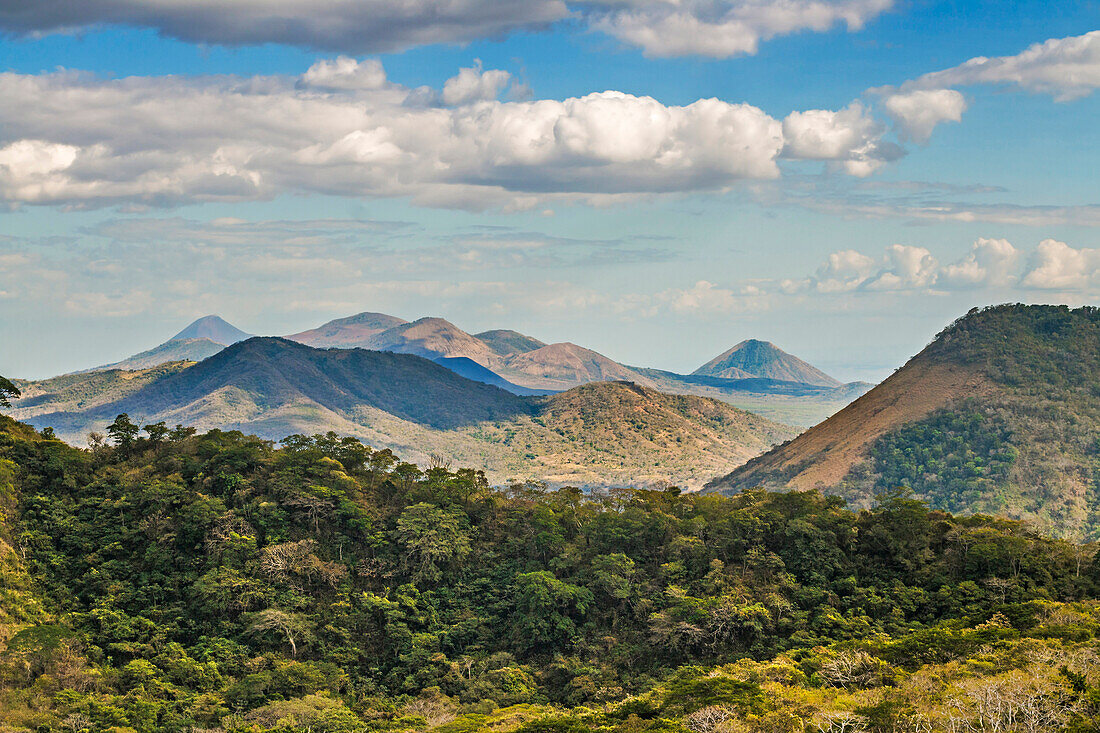 The North West volcanic chain, distant on left Momotombo, centre Rota and Las Pilas complex, on right Momotombito and Santa Clara, Leon, Nicaragua, Central America