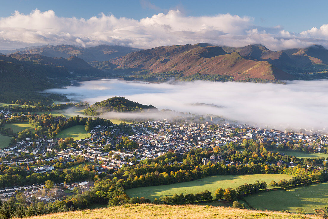Keswick and mist covered Derwent Water at dawn, Lake District National Park, Cumbria, England, United Kingdom, Europe