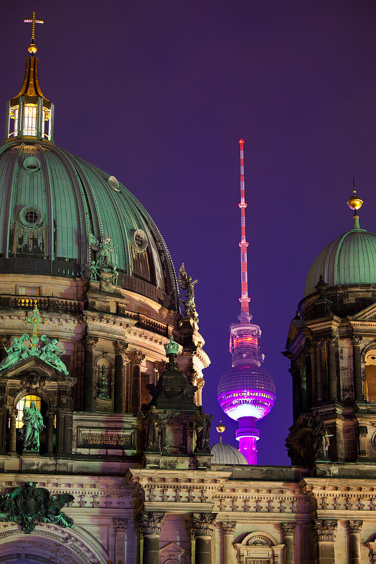 Close-up of the Berliner Dom (Cathedral) with the Television Tower in the background at night, Berlin, Germany, Europe