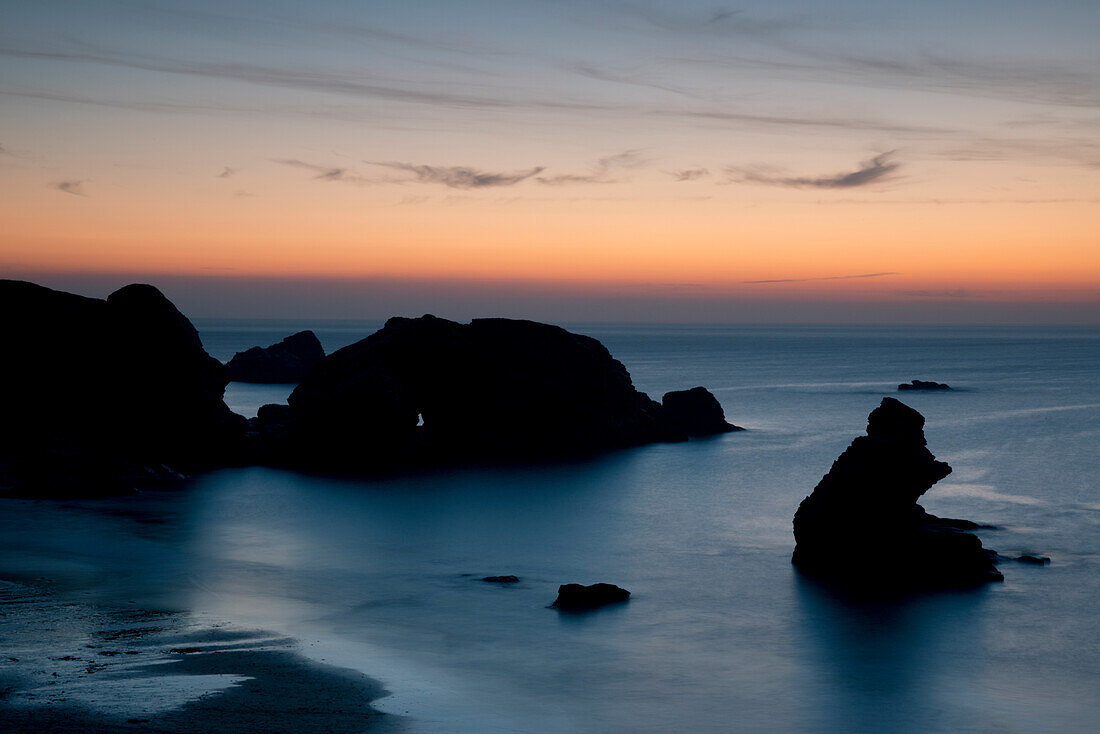 Sunset over unusual rock formations in Porthcothan Bay, Cornwall, England, United Kingdom, Europe