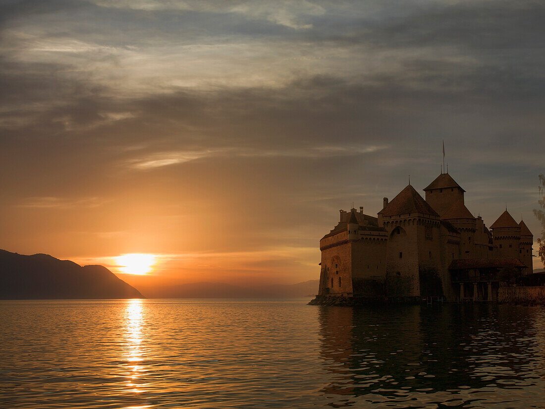 The Castle of Chillon, on Lake Geneva at sunset, Montreux, Canton Vaud, Switzerland, Europe
