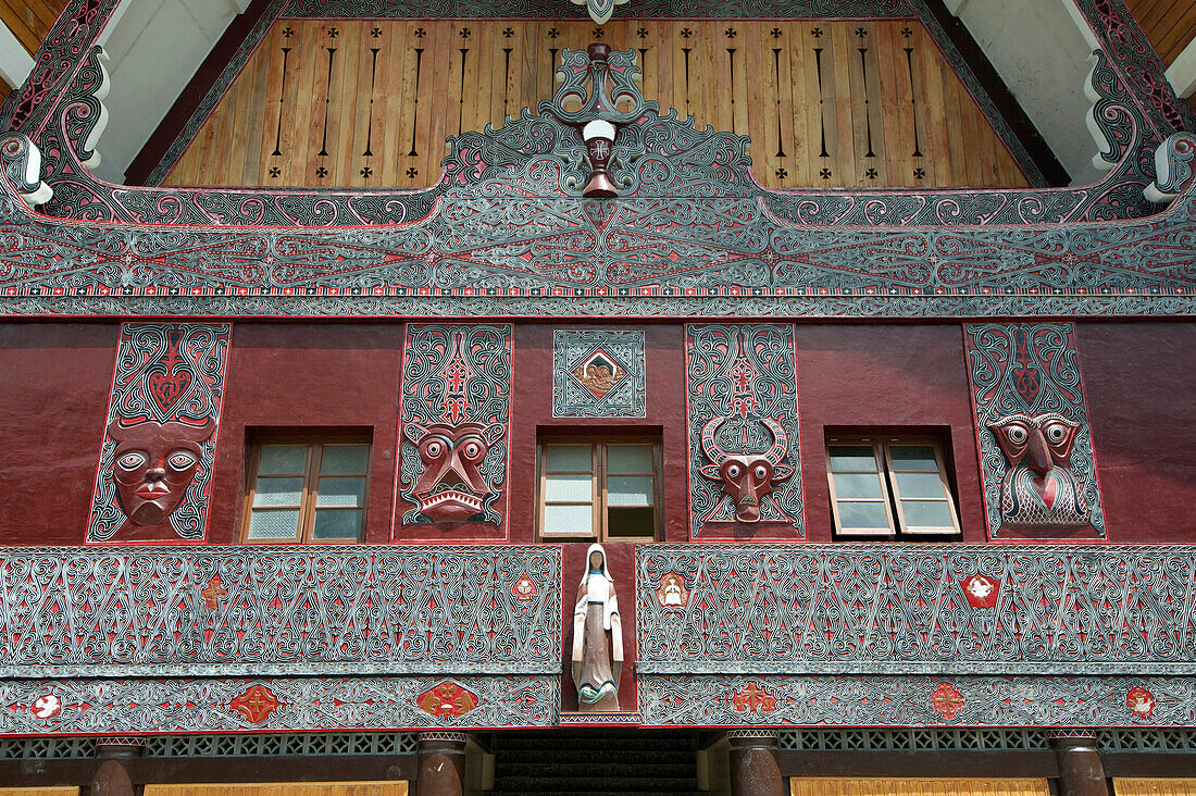 Ornate traditional Batak painted carvings on large Batak style Catholic church, Pangururan, Samosir Island, Sumatra, Indonesia, Southeast Asia, Asia