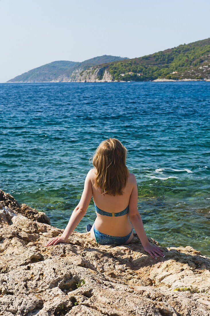 Hvar Town, tourist on a beach, Hvar Island, Dalmatian Coast, Adriatic, Croatia, Europe