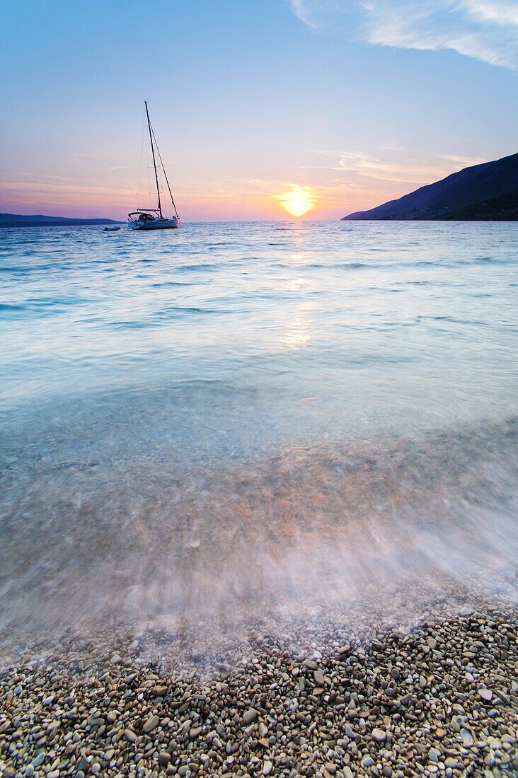 Adriatic Sea off Zlatni Rat Beach at sunset, Bol, Brac Island, Dalmatian Coast, Croatia, Europe