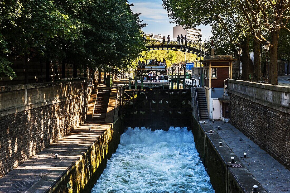 Tourist boat in a canal lock, Canal Saint Martin, Paris, France, Europe