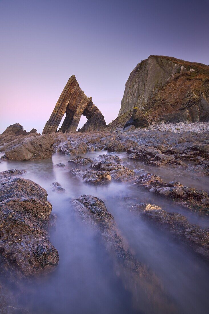 Blackchurch Rock and rocky ledges at twilight, Mouthmill Beach, North Devon, England, United Kingdom, Europe