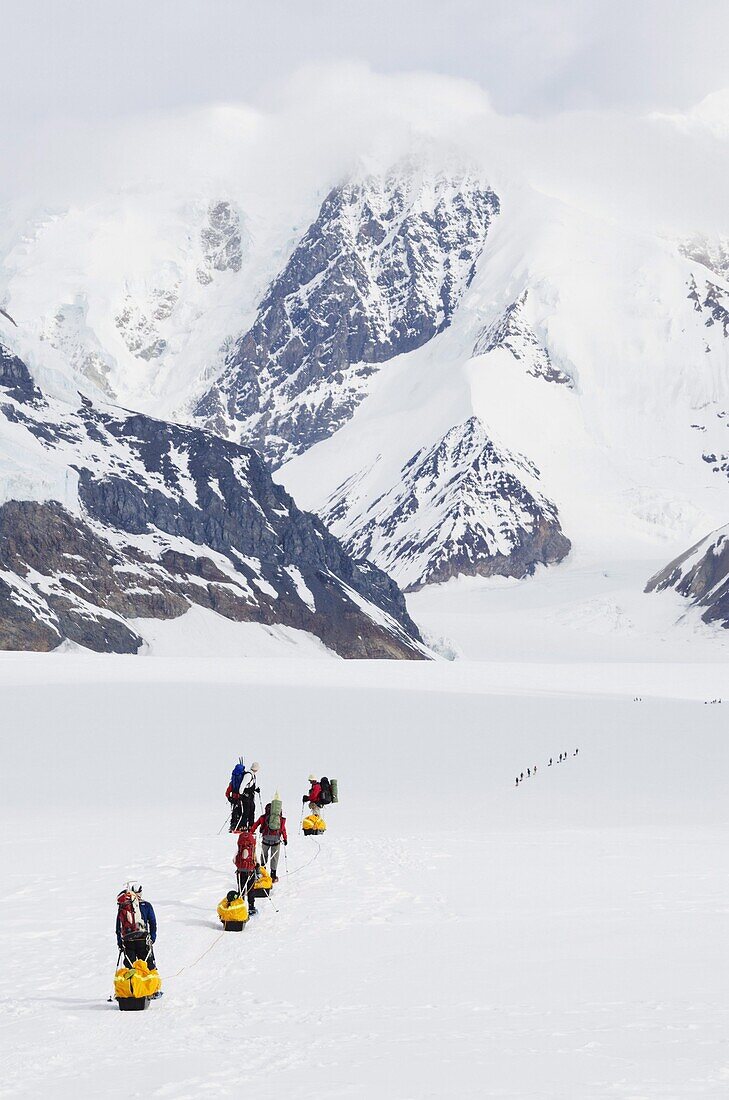 Climbing expedition leaving base camp on Mount McKinley, 6194m, Denali National Park, Alaska, United States of America, North America