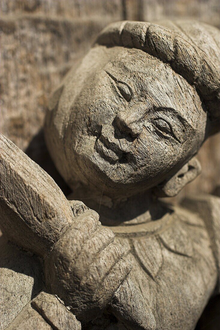 Carving on traditional wooden monastery, once part of the Royal Palace complex and used as an apartment by King Mindon, Shwenandaw Kyaung (Golden Palace Monastery), Mandalay, Myanmar (Burma), Asia