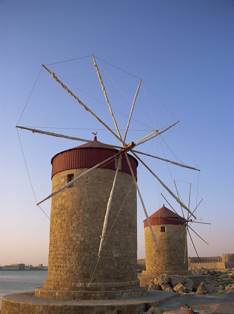 Traditional old stone windmills in dusk light, Rhodes Town, Rhodes, Dodecanese Islands, Greek Islands, Greece, Europe