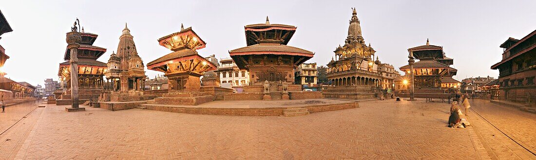Buildings in Durbar Square, from the left, Hari Shankar Mandir, statue of Yoganarendra Malla on pillar, shikhara style temple, two pagoda roofed temples the right hand unlit one being the Jagan Naryan Mandir, the shikhara style Krishna Mandir, column topp