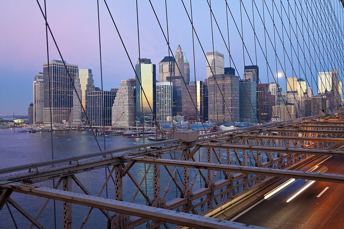 Downtown Financial District skyline of Manhattan viewed from the Brooklyn Bridge at dawn, New York City, New York, United States of America, North America